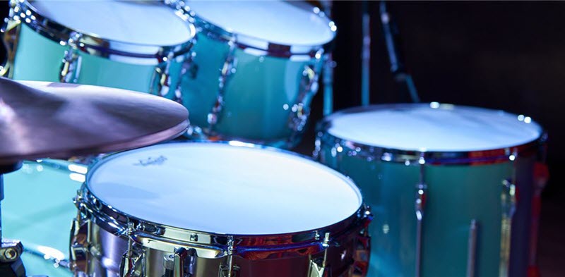 Drum kit with 5 snare drums and a hi-hat cymbal set.