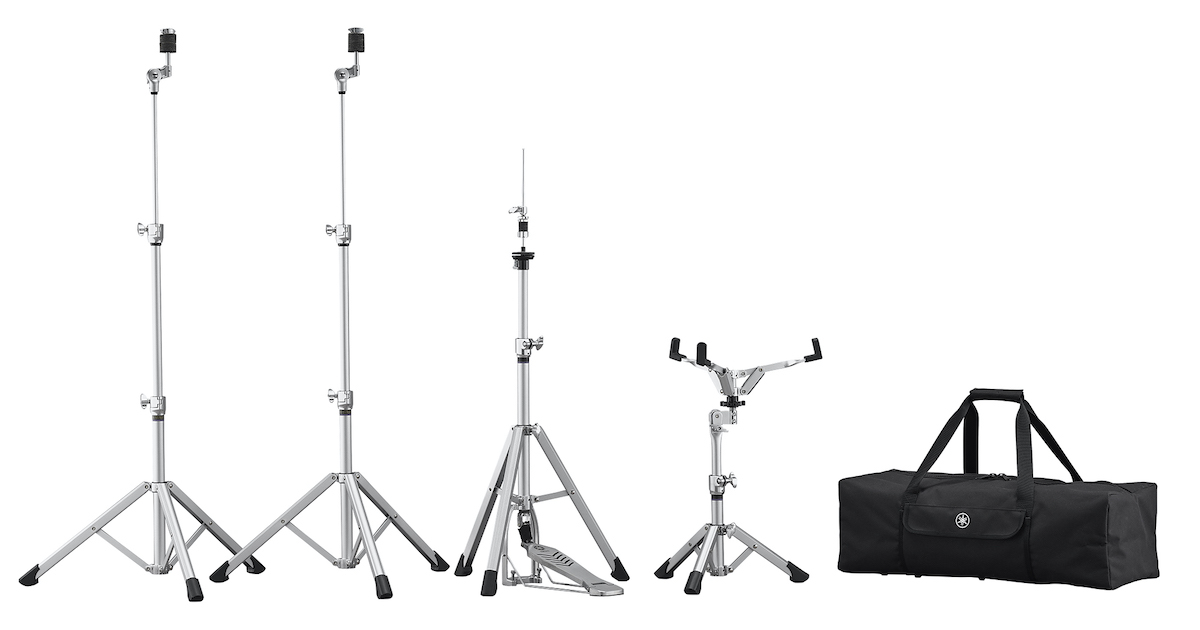 HW3_a_0001_sml Four collapsible dram stands shown in various stages of being collapsed and their black rectangular carrying case.