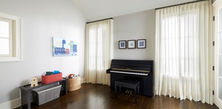 upright-against-wal Upright piano in kid's room.