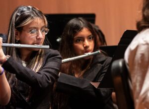 two students playing the flute